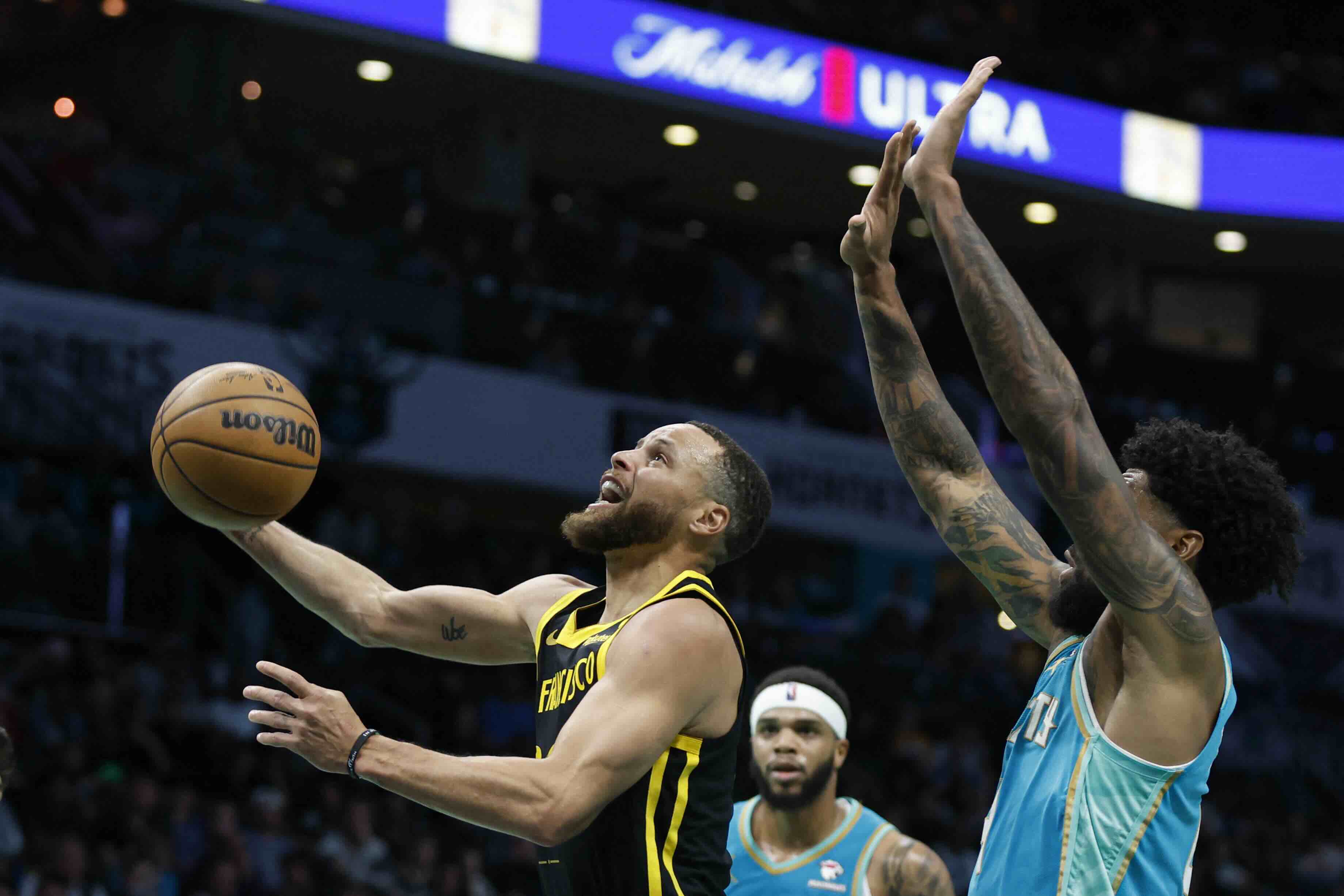Stephen Curry scored 23 points in a return to his hometown as the visiting Golden State Warriors beat the Charlotte Hornets 115-97 