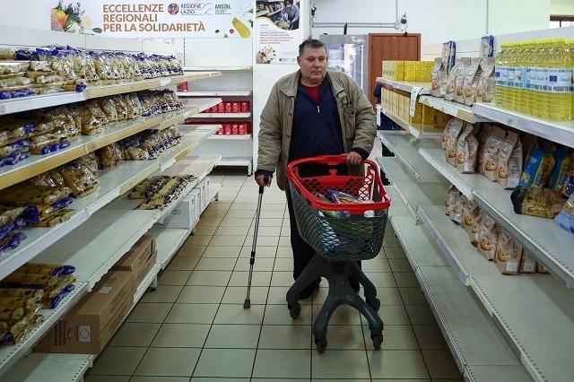 Domenico shops at Caritas Emporium. My arthritis does not help in finding a new job. Luckily there are places like this Emporium, said the 57-year-old, who who was a blacksmith before losing his job. REUTERS/ Guglielmo Mangiapane