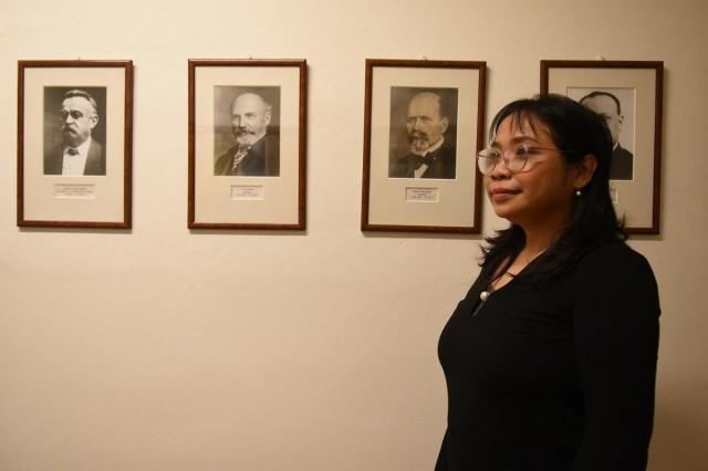 Expanded boundaries: In one of the hallways at the Oriental Institute hang a series of portraits of the great men and women who have headed the Institute since 1922. The current director, Mgr. TÃ¡?a DluhoÅ¡ovÃ¡, Ph.D., guides a group of researchers, including several women in senior leadership roles such as Dr. Alenzuela. 