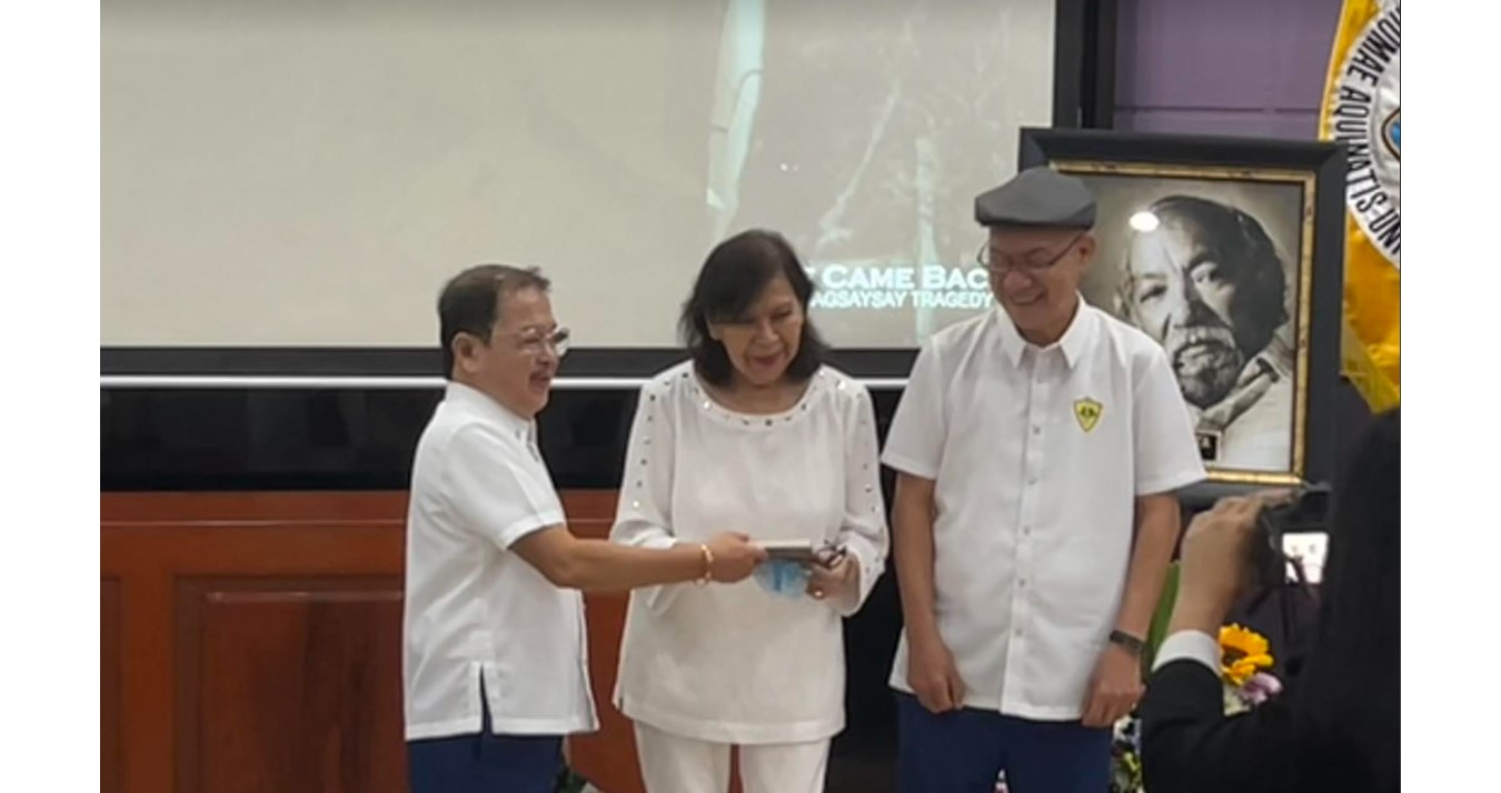 Nestor Mata’s sons Jan and Mike present a copy of the book “One Came Back” to Mila Magsaysay-Valenzuela, daughter of the late President Ramon Magsaysay