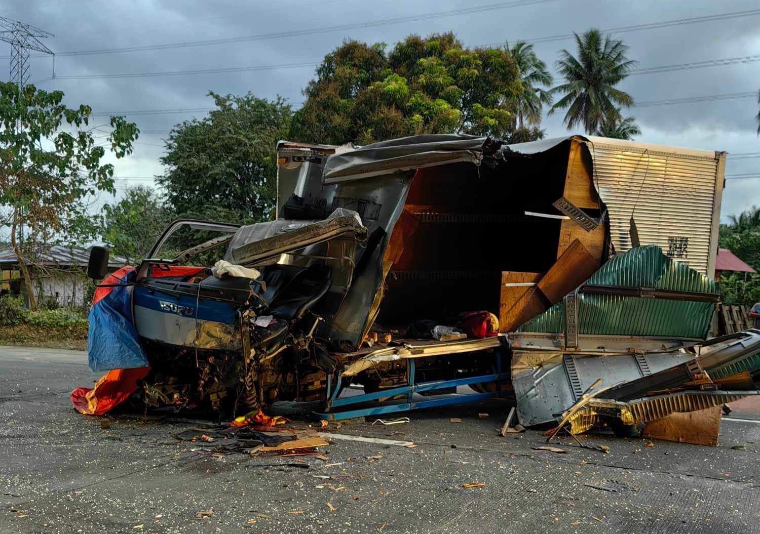 One killed after delivery van collides with bus in CamSur