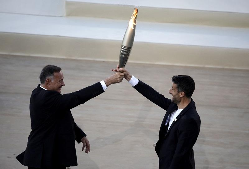 Paris organizers receive flame in Athens ahead of relay
