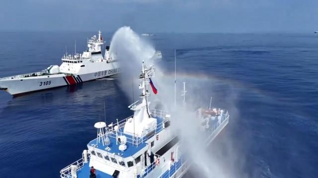 A China Coast Guard ship aims its water cannon toward the PCG ship BRP Bagacay on April 30, 2024. Screenshot from drone video by Raffy Tima 