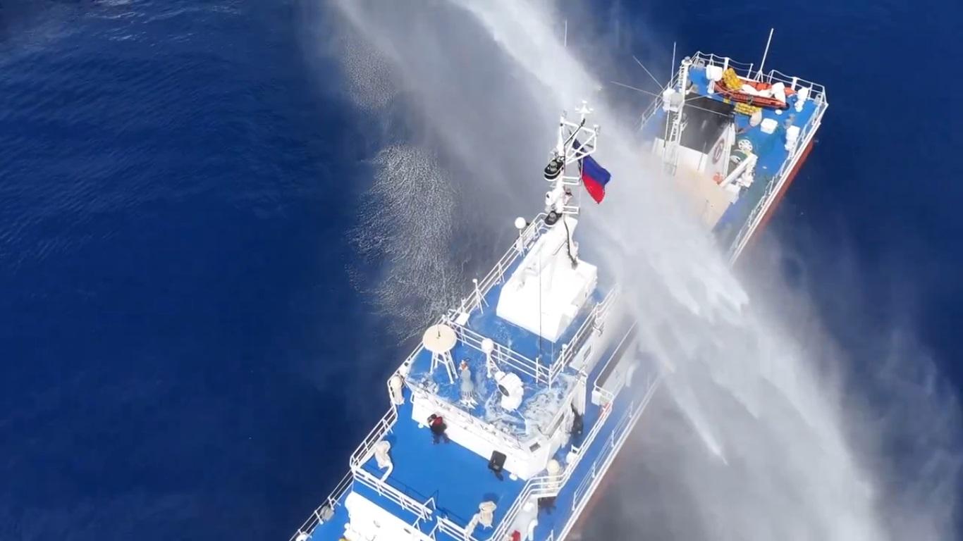 Philippine flag hit by water blasted by China Coast Guard