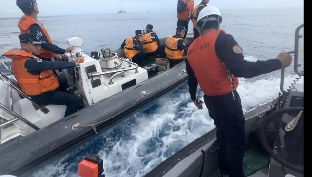 Chinese Coast Guard and Philippine Coast Guard personnel appear to be sizing each other up before positioning themselves for another round of ramming showdown.