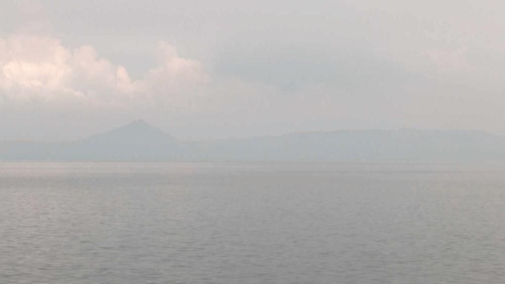 PHIVOLCS advises public to wear masks vs. vog as Taal continues degassing
