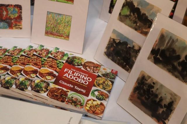 Tayag's artistry has encompassed the canvas and the cuisine, with his colorful oeuvre of watercolor paintings and his latest culinary publication, 'The Ultimate Filipino Adobo.' Photo by Andy PeÃ±afuerte III