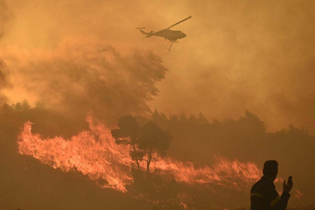 Residents flee as wildfire rages uncontrolled near Athens