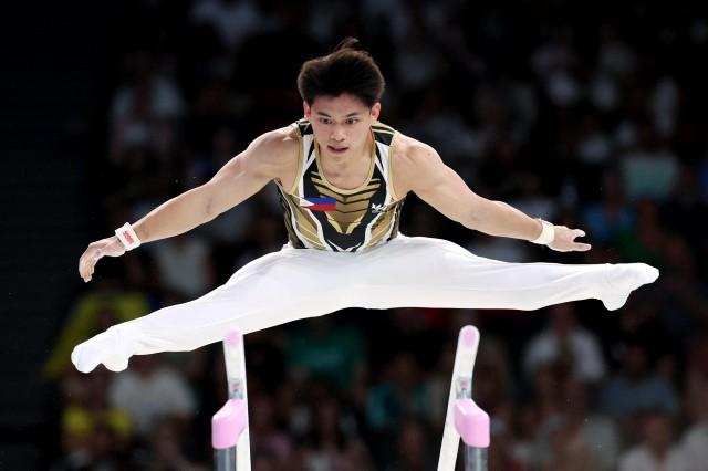 Paris 2024 Olympics - Artistic Gymnastics - Men's All-Around Final - July 31, 2024. Carlos Yulo of the Philippines in action on the Parallel Bars. REUTERS/Amanda Perobelli