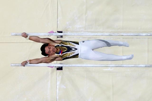 Paris 2024 Olympics - Artistic Gymnastics - Men's All-Around Final - July 31, 2024. Carlos Yulo of the Philippines in action on the Parallel Bars. REUTERS/Athit Perawongmetha