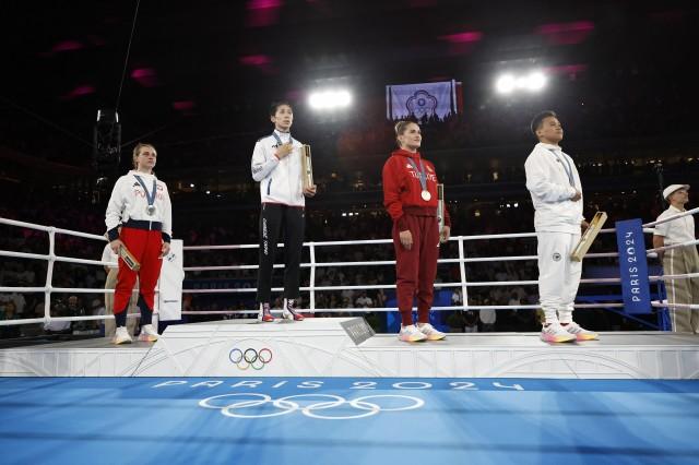 Gold medalist Lin Yu-Ting of Taiwan, silver medalist Julia Szeremeta of Poland, bronze medalist Esra Yildiz Kahraman of Turkey and bronze medalist Nesthy Petecio of Philippines. REUTERS/Peter Cziborra