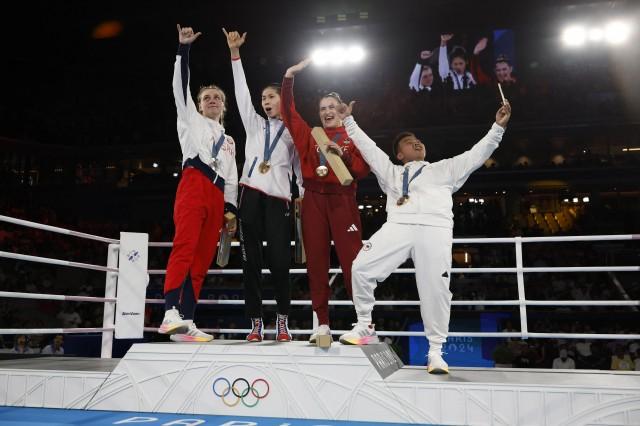 Gold medalist Lin Yu-Ting of Taiwan, silver medalist Julia Szeremeta of Poland, bronze medalist Esra Yildiz Kahraman of Turkey and bronze medalist Nesthy Petecio of Philippines. REUTERS/Peter Cziborra
