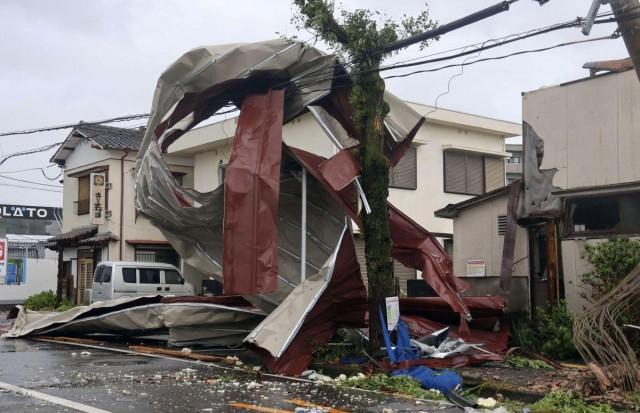 An object blown by strong winds caused by Typhoon Shanshan is stranded on a power line in Miyazaki, southwestern Japan, August 29, 2024, in this photo taken by Kyodo. Kyodo/via REUTERS