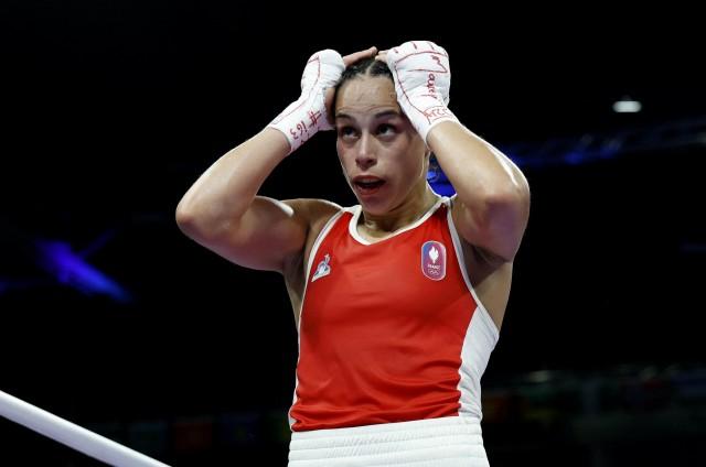 Paris 2024 Olympics - Boxing - Women's 57kg - Prelims - Round of 16  August 02, 2024. Amina Zidani of France reacts after losing her fight against Nesthy Petecio of Philippines. REUTERS/Peter Cziborra