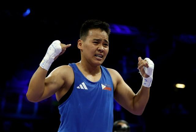 Paris 2024 Olympics - Boxing - Women's 57kg - Prelims - Round of 16 - August 02. Nesthy Petecio of Philippines reacts after winning her fight against Amina Zidani of France. REUTERS/Peter Cziborra