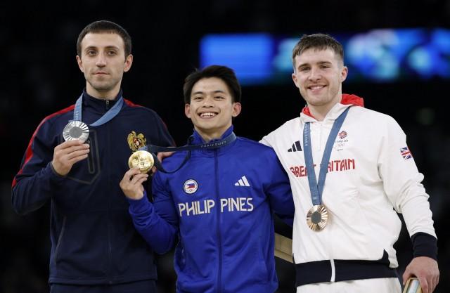 Paris 2024 Olympics -  August 04, 2024. Gold medalist Carlos Yulo of Philippines, silver medalist Artur Davtyan of Armenia, and bronze medalist Harry Hepworth of Britain. REUTERS/Amanda Perobelli