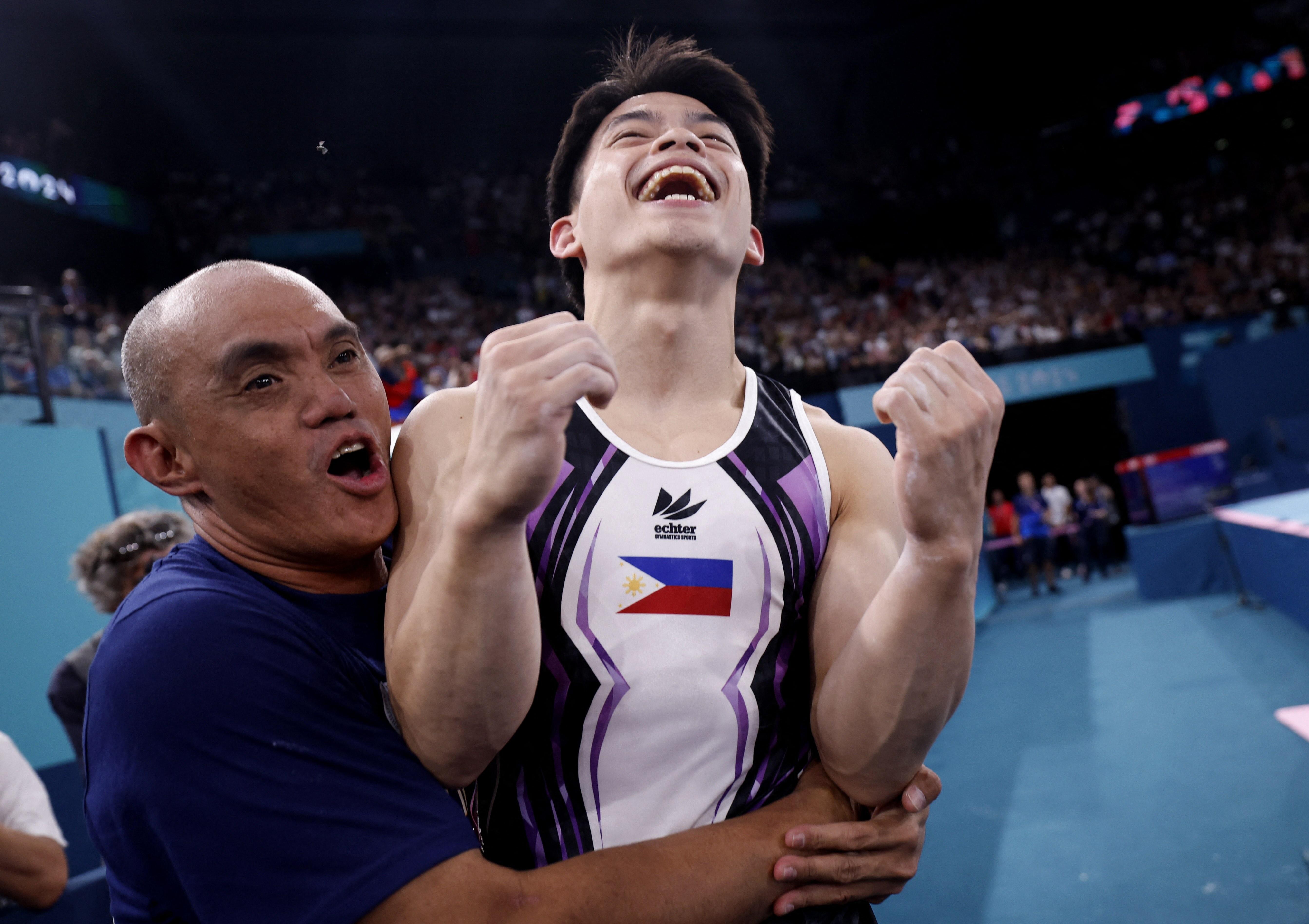 Carlos Yulo celebrates second Olympic gold