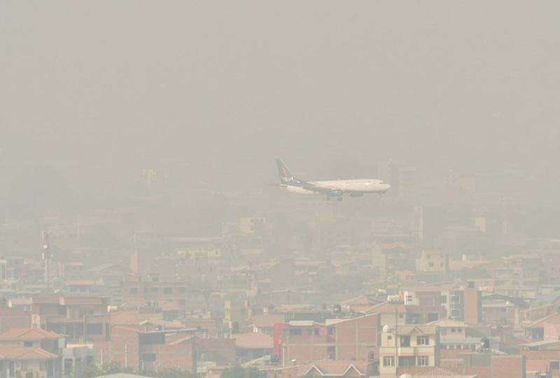 As Bolivia wildfires rage, smoke turns day into night