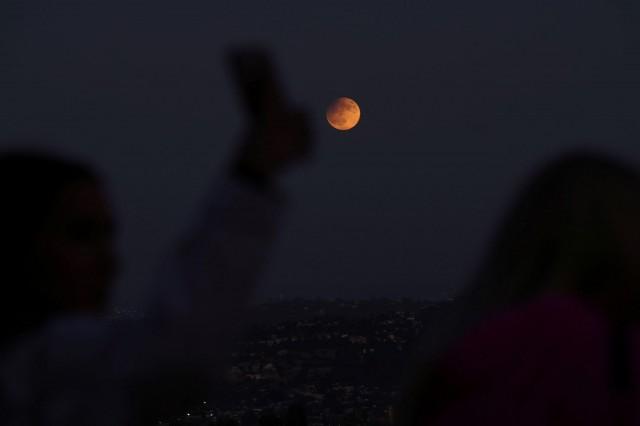 A Harvest Supermoon partial lunar eclipse is pictured in Los Angeles, California, U.S., September 17, 2024. REUTERS/Mario Anzuoni