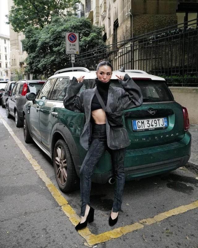 Heart slayed a streetwear outfit for Onitsuka Tiger, featuring a black cropped top with a turtle neck, printed leggings, and an oversized blazer. Photo: Heart Evangelista/IG