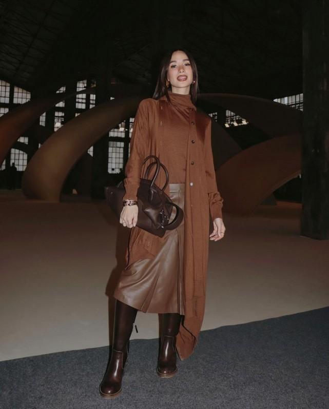 For Tod's, Heart went on a monochromatic look with different textures: a long cardigan over a brown top matched with a brown leather skirt and knee-length boots. Photo: Heart Evangelista/IG
