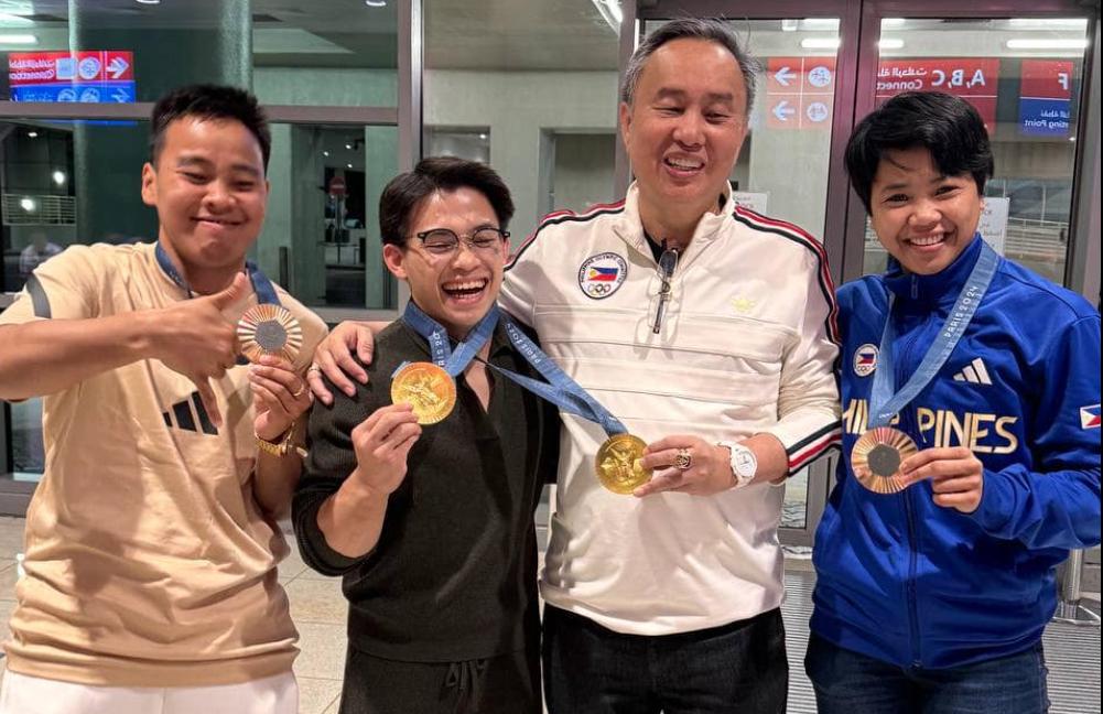 POC president Bambol Tolentino with medalists Carlos Yulo, Nesthy Petecio, and Aira Villegas