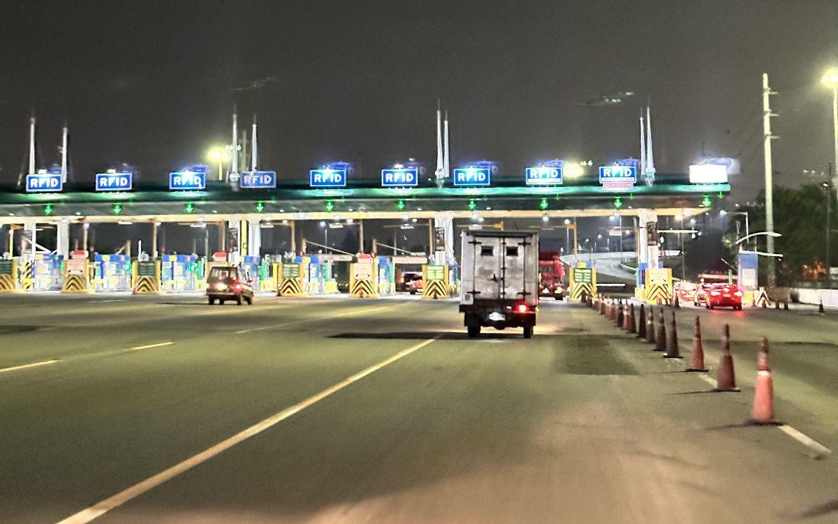 Motorists slow down as they approach a toll plaza of the Manila-Cavite Toll Expressway