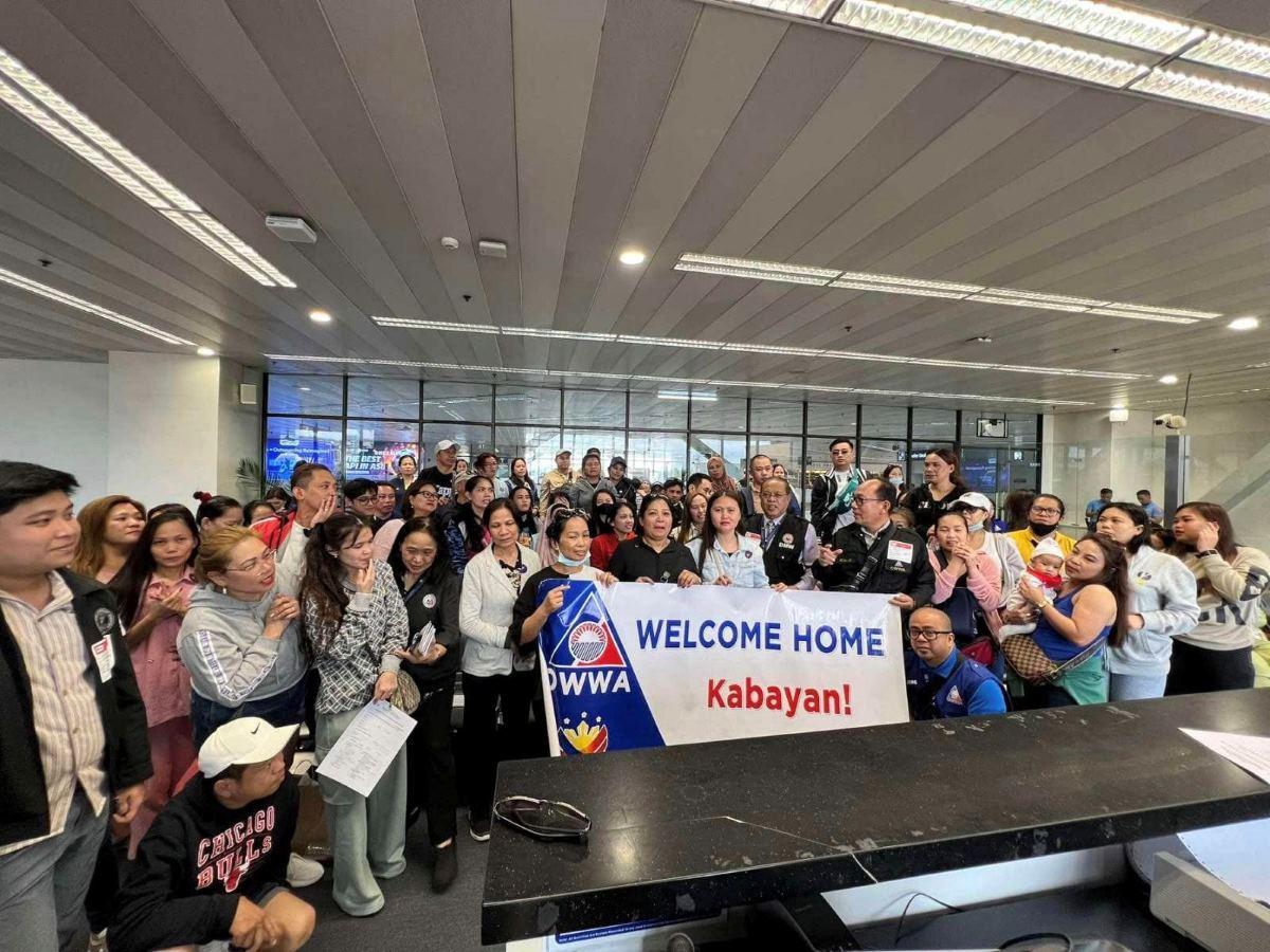 OFWs from UAE arrive at NAIA Terminal 3 on Sept. 13, 2024