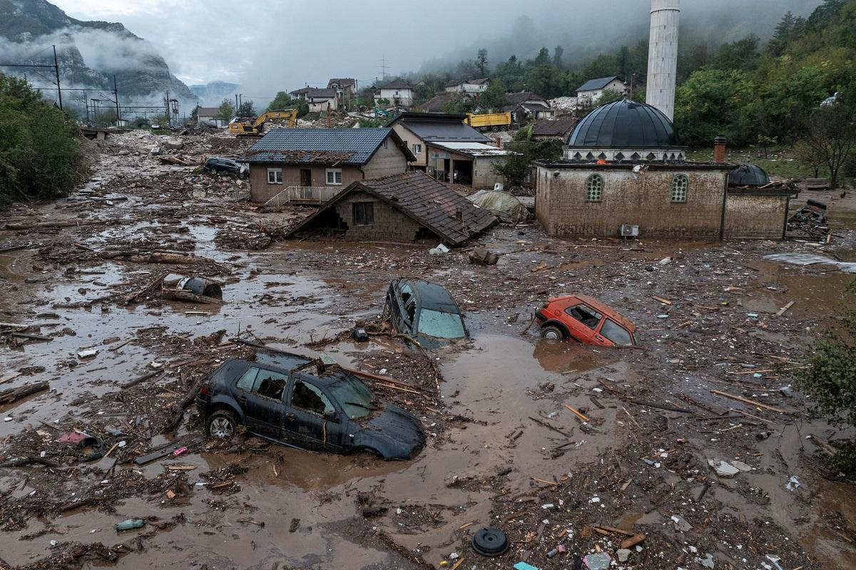 Bosnian villagers sift through ruined homes after devastating flash floods