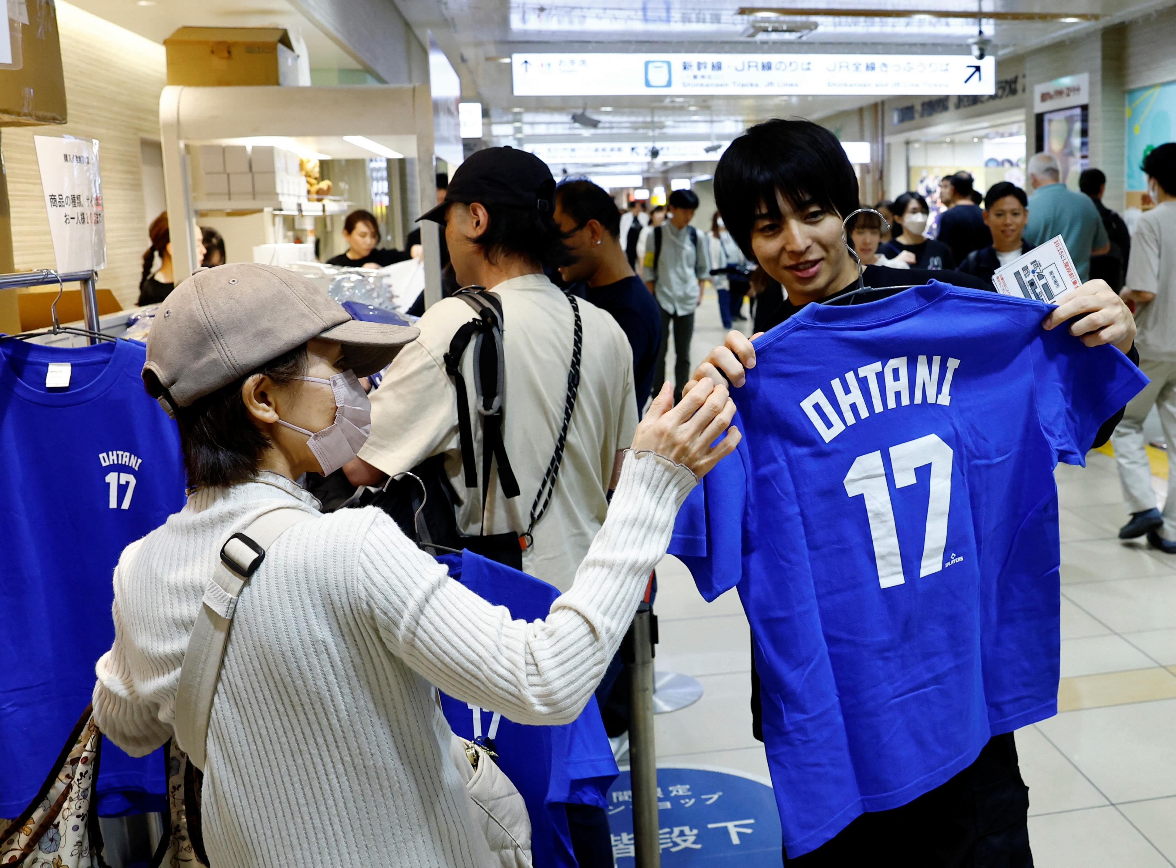 Fans in Japan line up for Shohei Ohtani merchandise ahead of World