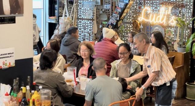  Gregorio Rosas, or 'Tito Greg,' attending to some diners. Greg was brought to Seattle from the Philippines in 1978 by a Jewish family. Photo by JP Soriano/GMA Integrated News