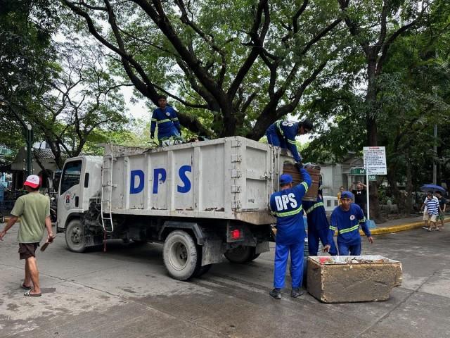 Workers are seen at the Manila South Cemetery on Thursday, October 31, 2024 as the site prepares for the influx of visitors expected on All Saints' Day and All Souls' Day. Tina Panganiban-Perez/GMA Integrated News