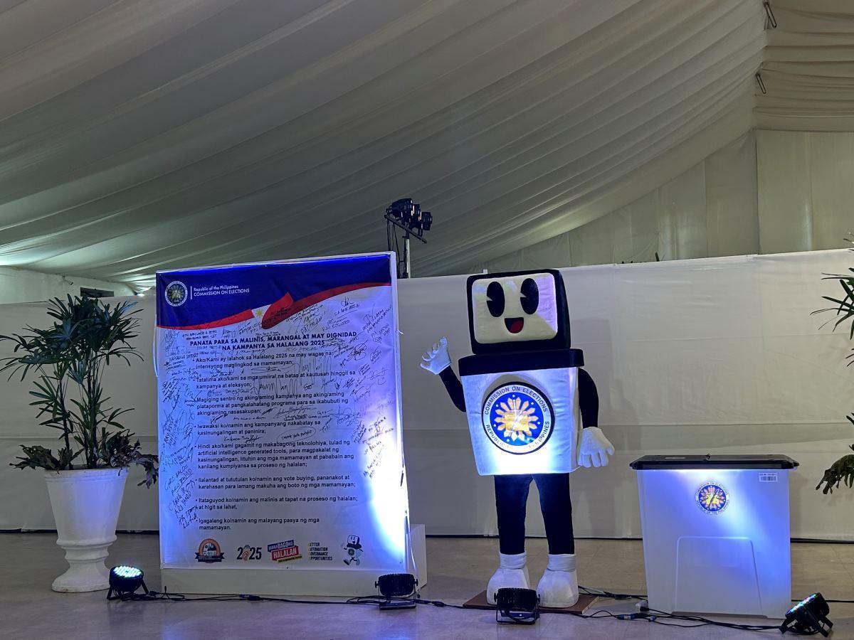 Comelec mascot ACM welcomes aspirants on last day of filing of COCs, CONAs