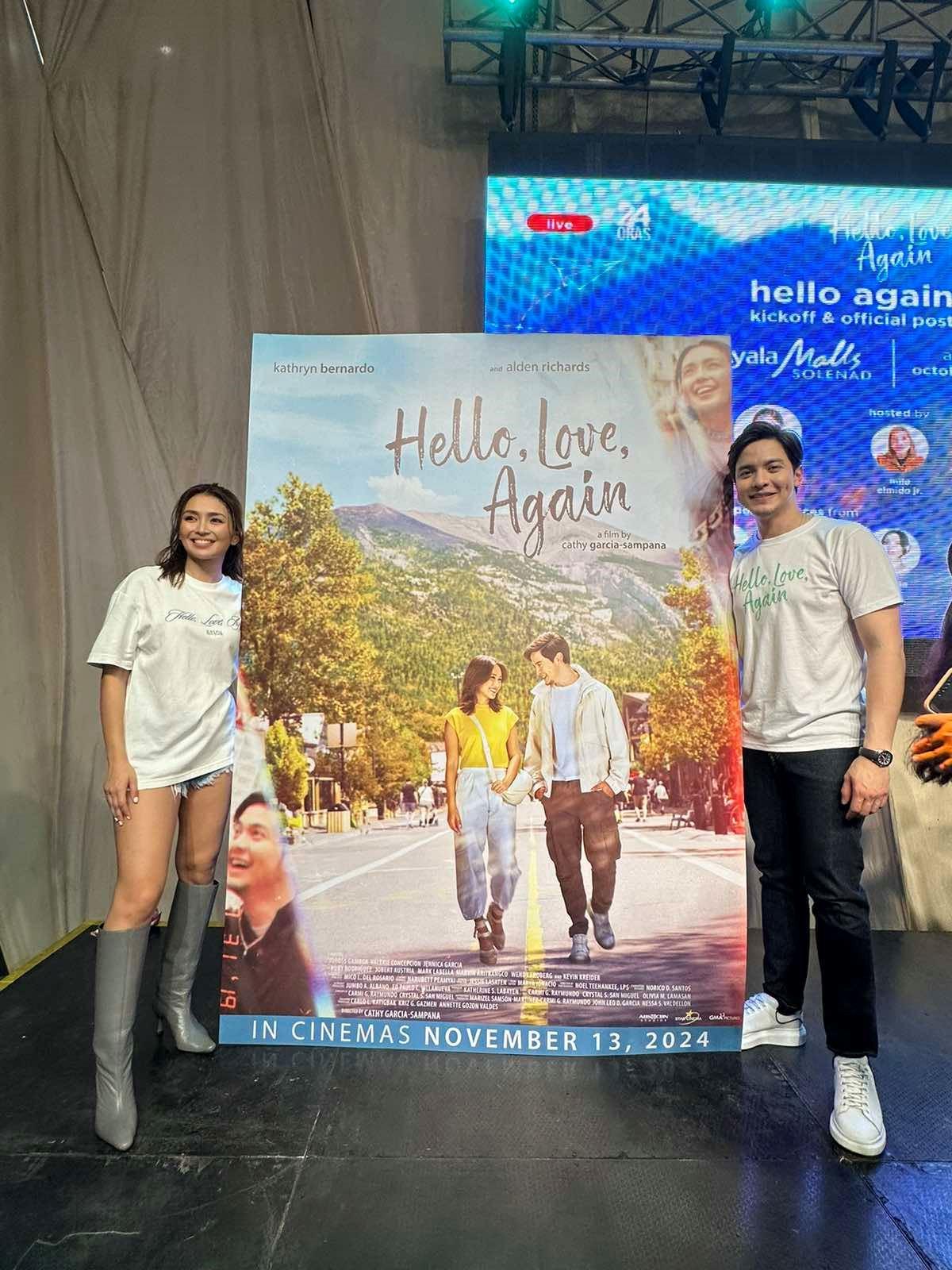 Kathryn Bernardo and Alden Richards with Hello, Love, Again poster