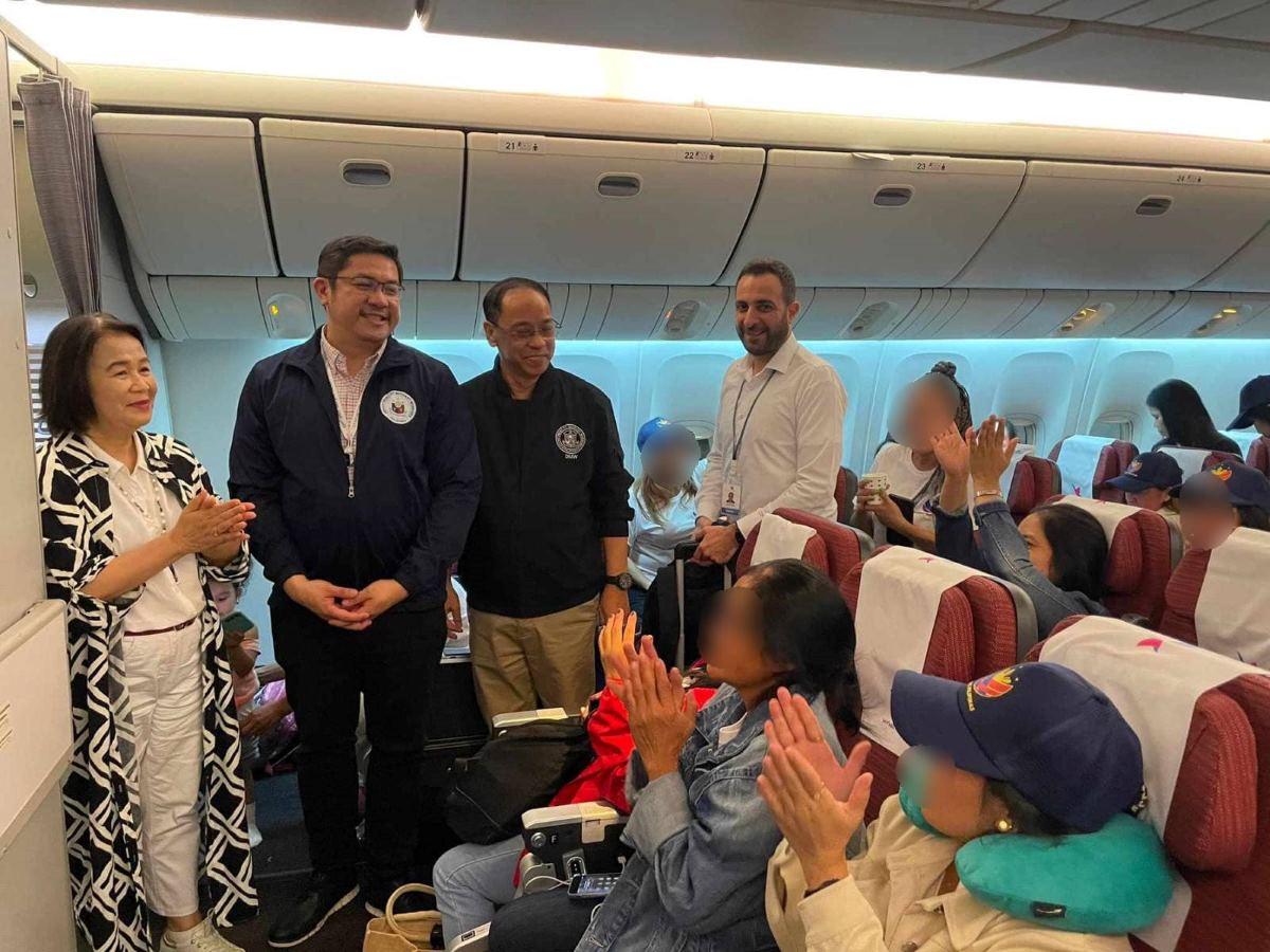 Philippine Ambassador to Qatar Lilibeth Pono greets the 290 Filipinos repatriated from Lebanon