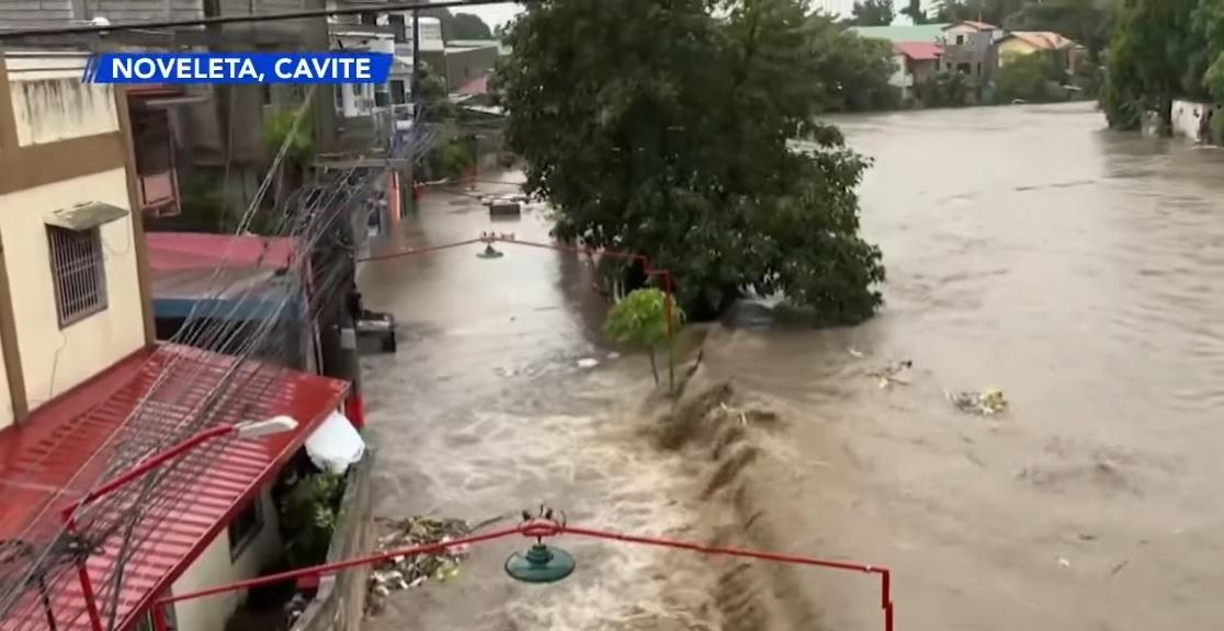 Noveleta, Cavite residents brave chest-deep floods brought by Kristine ...