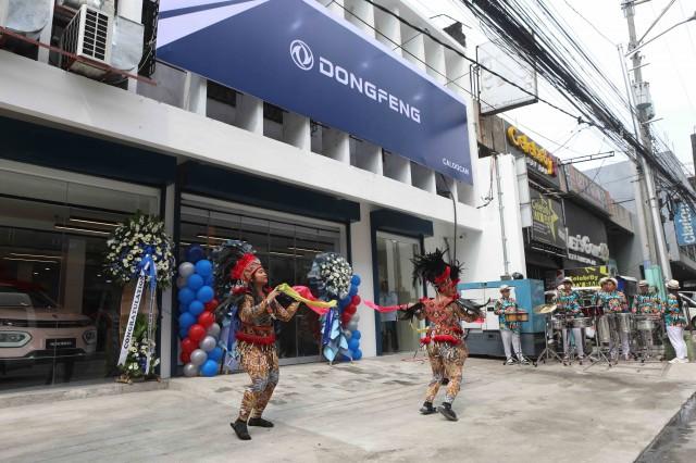  THE Caloocan dealership opens with a festive dance.