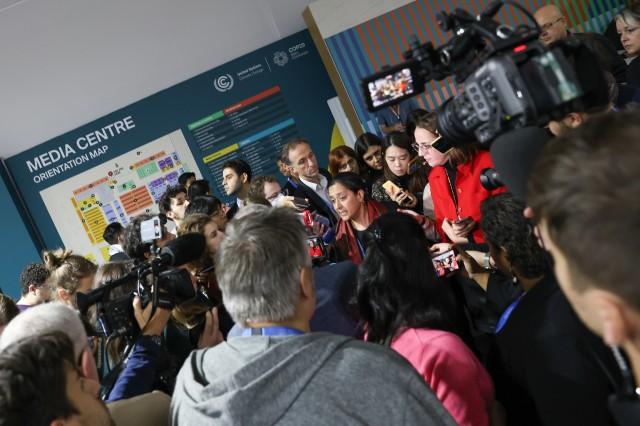 Rachel Cleedis of Union of Concerned Scientists and CAN International's Rebecca Thissen on Thursday giving a quick media huddle after a draft text of the NCQG showed the number at $250B. Photo: UN Climate Change - Kiara Worth)