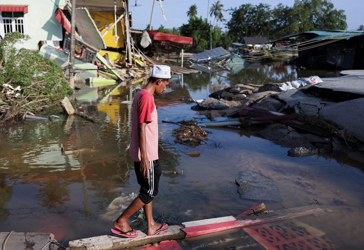 Malaysia towns clean up after 6 months" worth of rain in 5 days