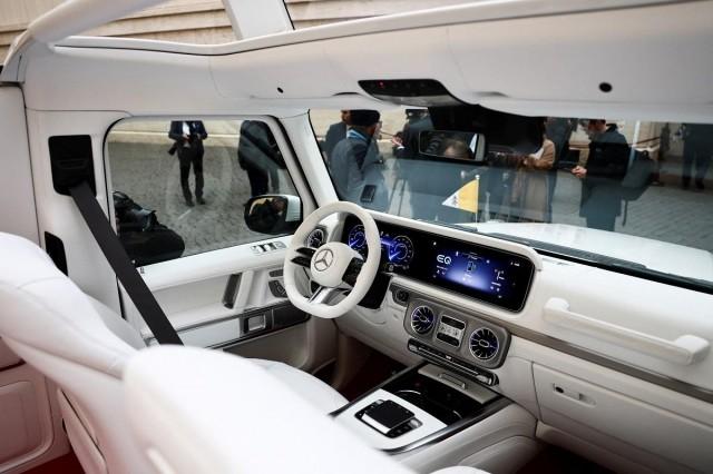 A photographer takes a picture of the interior of the new open popemobile on the day it's received by Pope Francis at the Vatican, December 4, 2024. REUTERS/ Yara Nardi