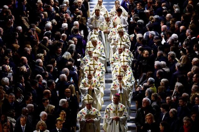 Priests and clergy members arrive to attend the inaugural Mass. REUTERS/ Sarah Meyssonnier/ Pool