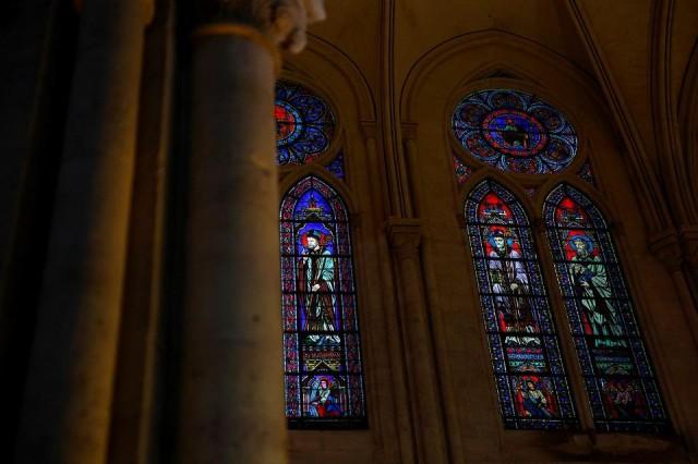 View of the stained glass windows during the inaugural Mass, with the consecration of the high altar. REUTERS/ Sarah Meyssonnier/ Pool