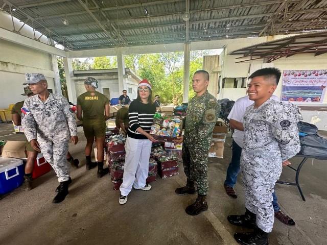 The school principal with uniformed personnel and the BFAR representative. Ian Cruz/GMA Integrated News