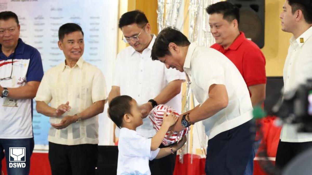 Marcos leads gift giving in residential caring institutions