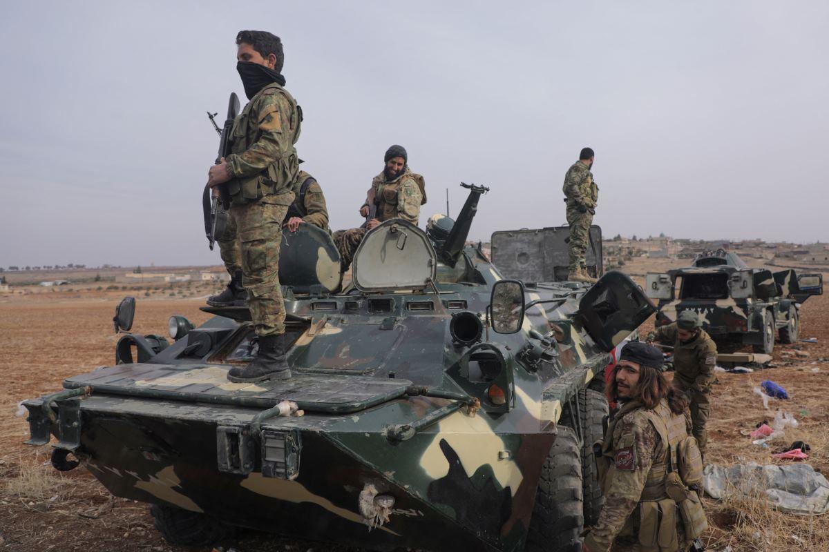 Rebel fighters in the countryside of Homs, Syria