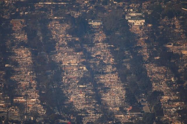 An aerial view shows debris from burned properties following the Palisades Fire at the Pacific Palisades neighborhood in Los Angeles, California, January 10, 2025. REUTERS/ Daniel Cole