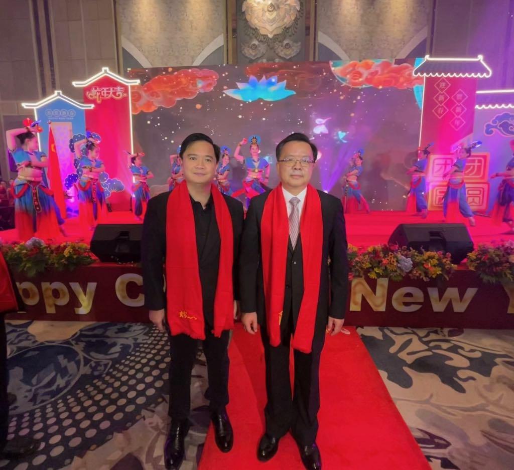 Amoroso poses with Chinese Ambassador Huang Xilian at the event.