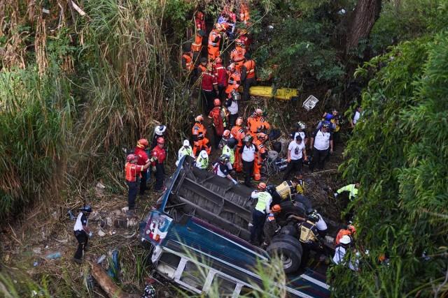 First responders work at the site of a deadly bus crash in Guatemala City, Guatemala, February 10, 2025. REUTERS/ Cristina Chiquin