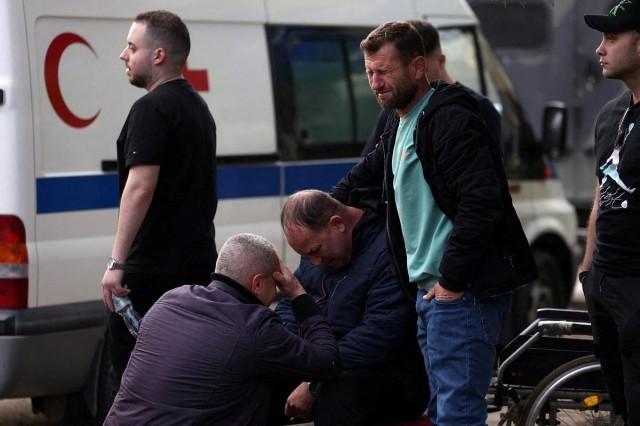People react outside a hospital, following a fire in a nightclub resulting in casualties, in the town of Kocani, North Macedonia, March 16, 2025. REUTERS/ Alexandros Avramidis
