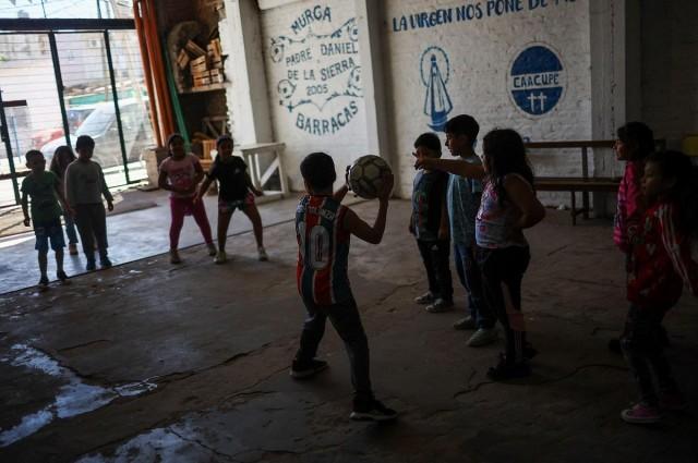 Children play inside the Virgen de Caacupe chapel, where Pope Francis, then a young Jorge Mario Bergoglio used to visit regularly, at the Villa 21-24, in Buenos Aires, Argentina March 10, 2025. REUTERS/ Agustin Marcarian